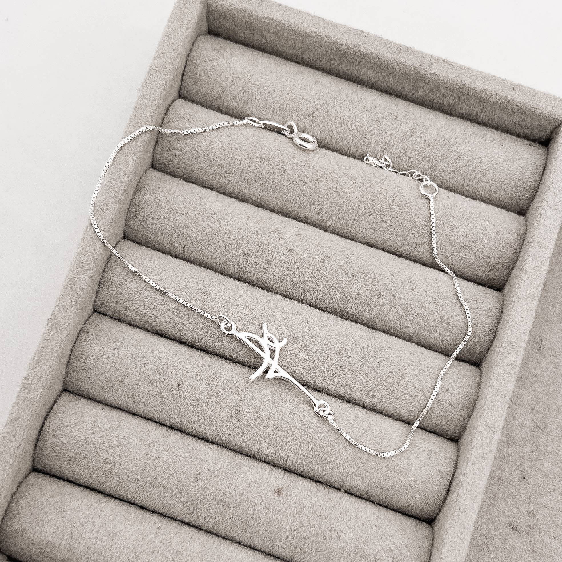 Pulseira entremeio escrito fé