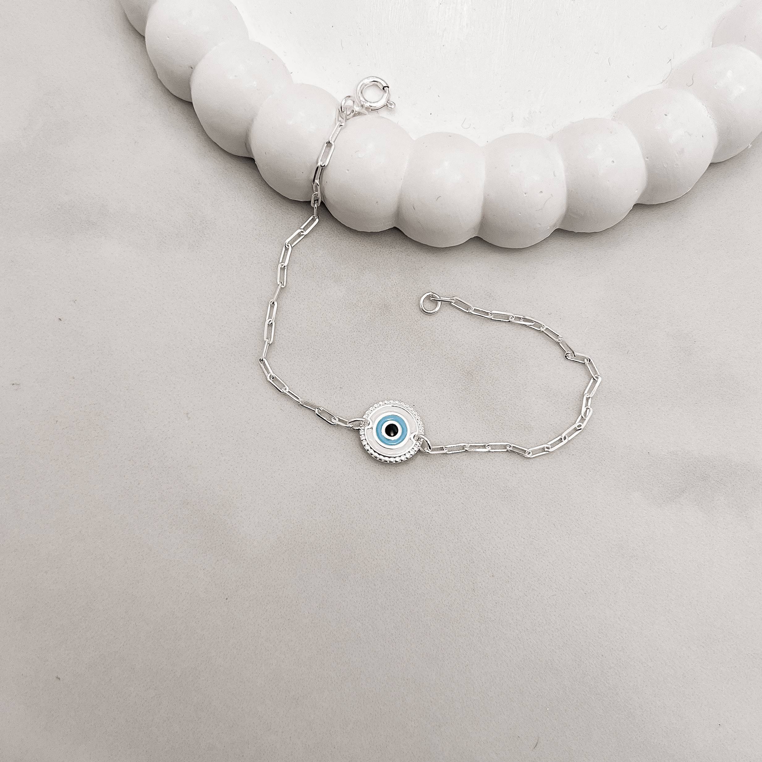 Imagem Secundária Pulseira entremeio medalha olho grego 11mm resina