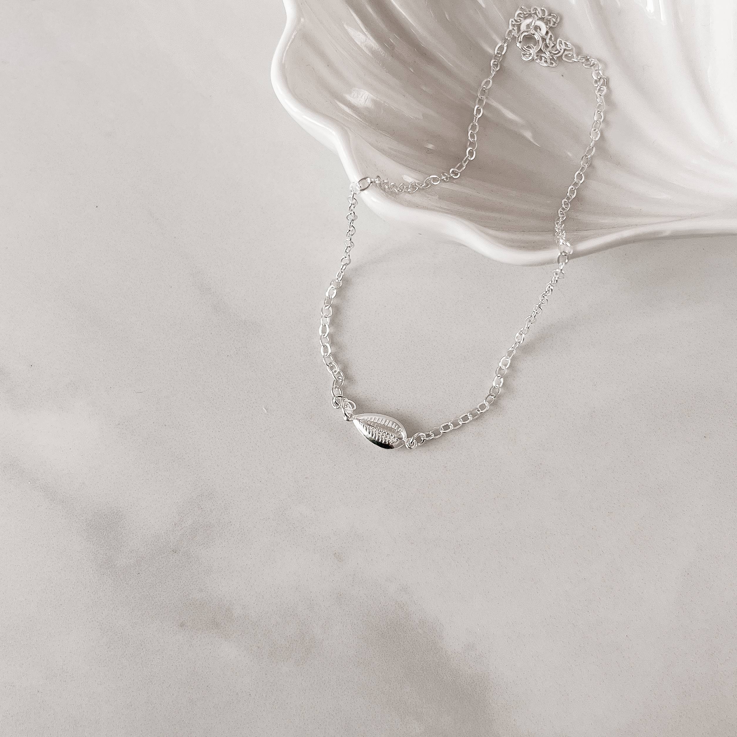 Imagem Secundária Colar entremeio búzios 12mm 40cm