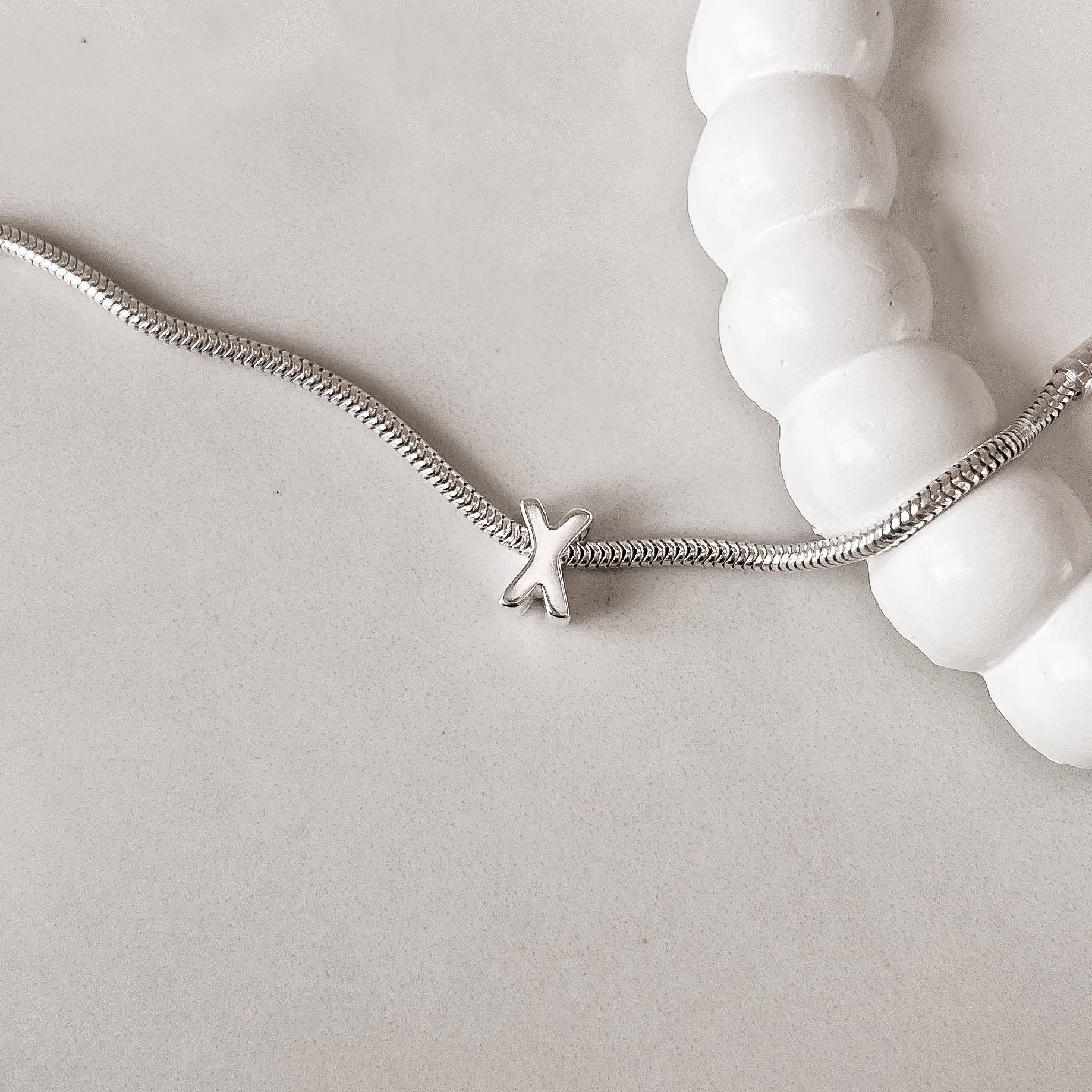 Berloque separador letra X 10mm