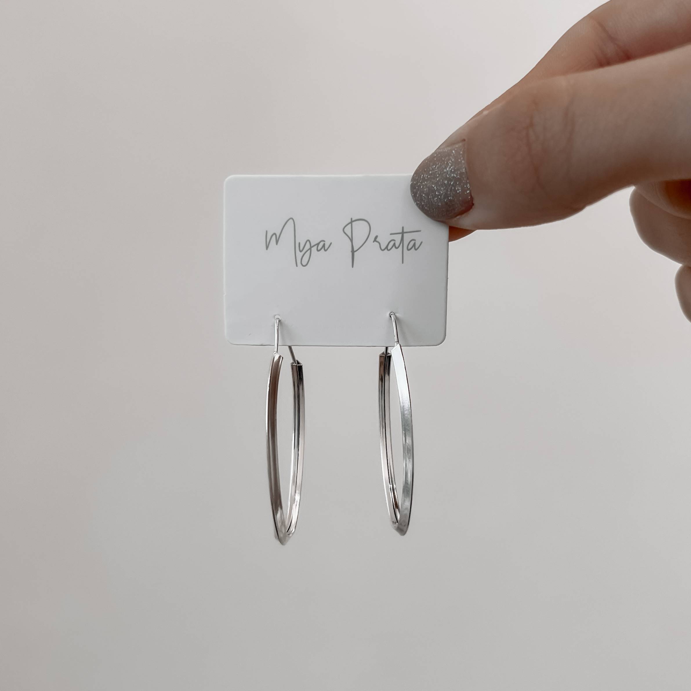 Imagem Secundária Argola oval 37x13mm fio triângulo