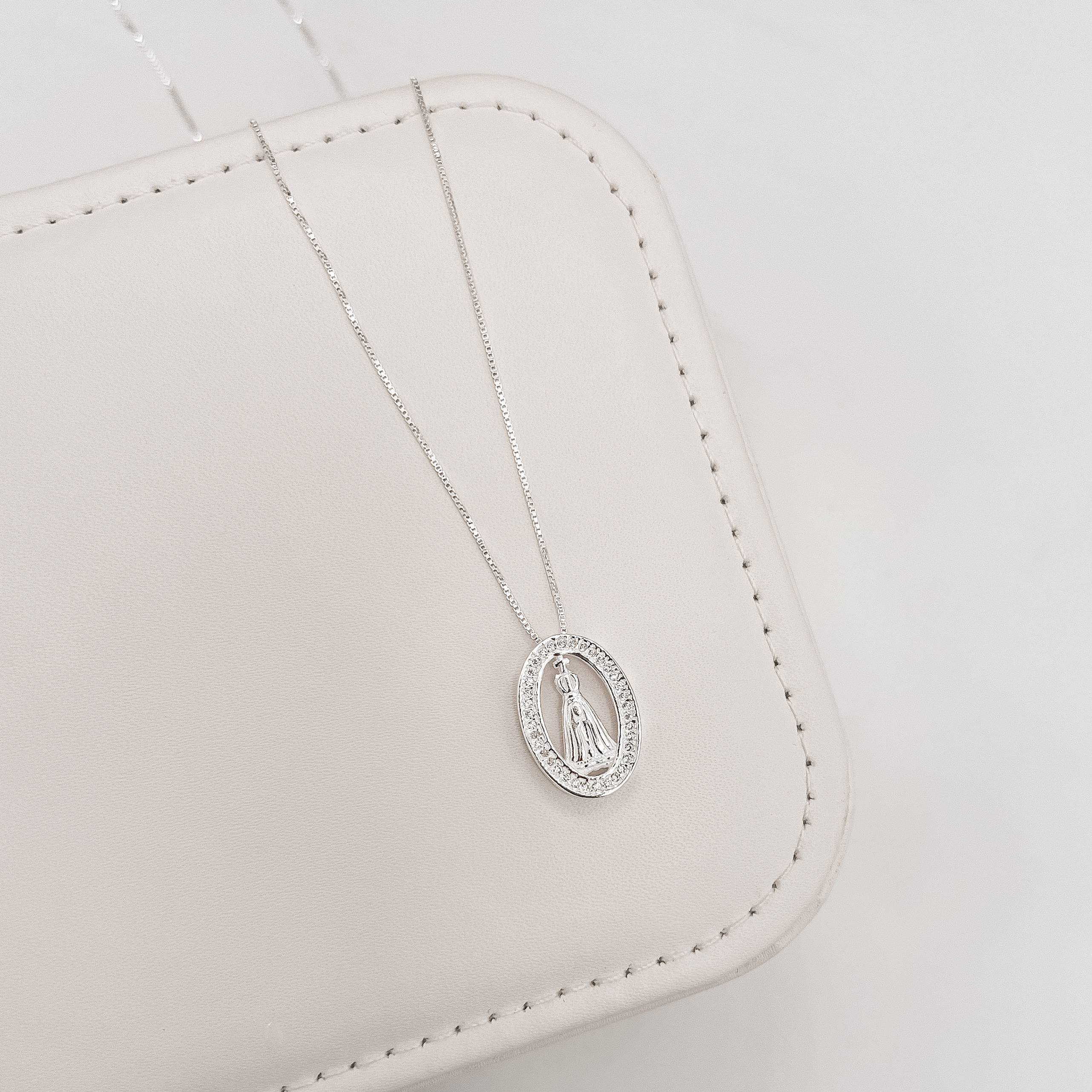 Imagem Secundária Colar Nsa. Sra. Aparecida oval cravejada 18mm 45cm