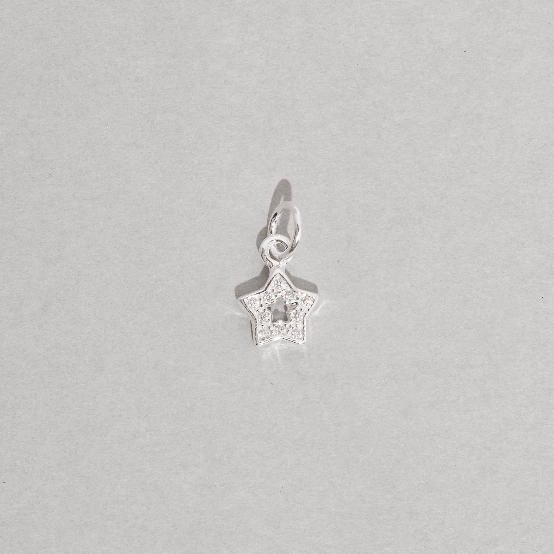 Imagem Secundária Pingente estrela vazada cravejada 7mm