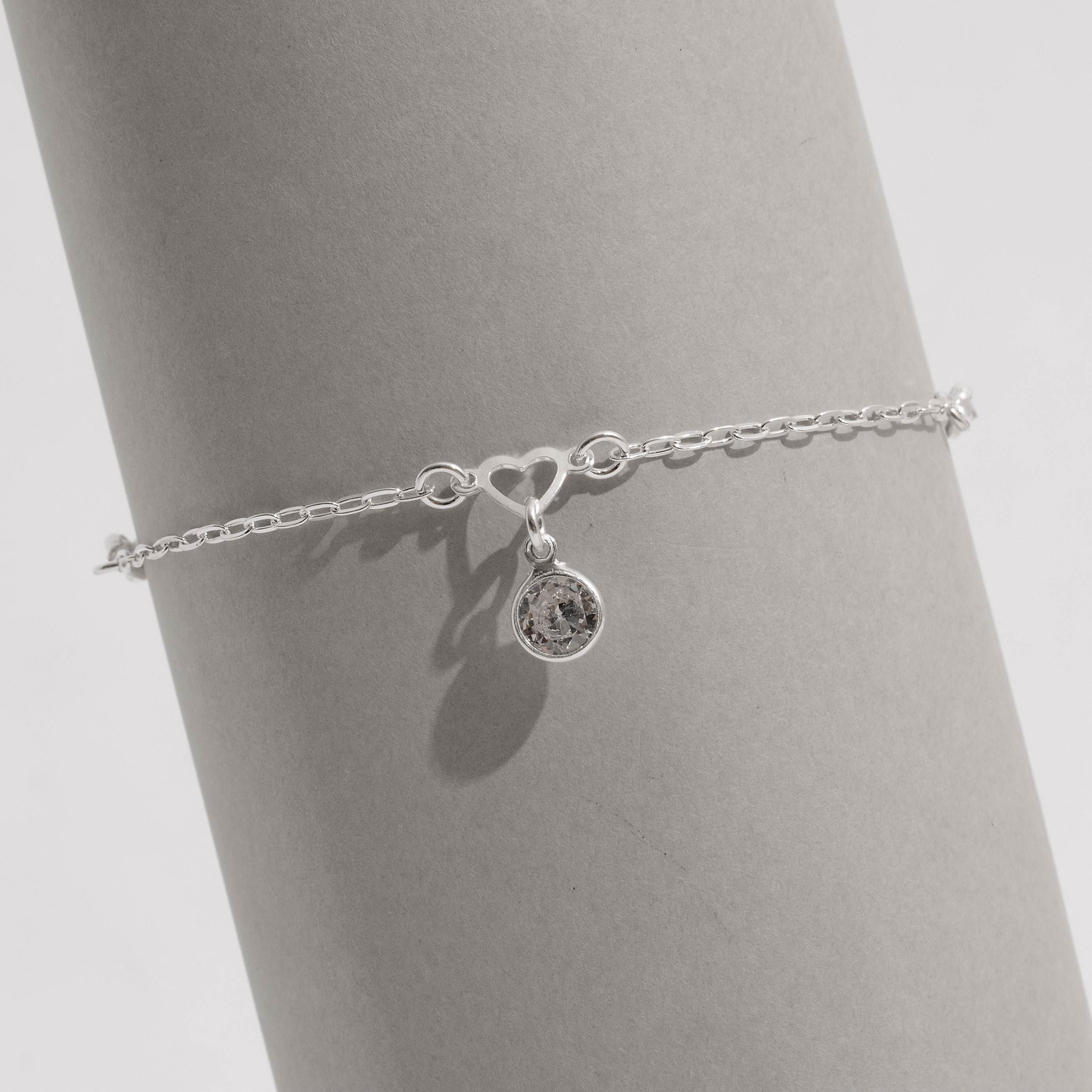 Imagem Secundária Pulseira entremeios coração vazado e zircônias com pingente zircônia 7mm 19cm