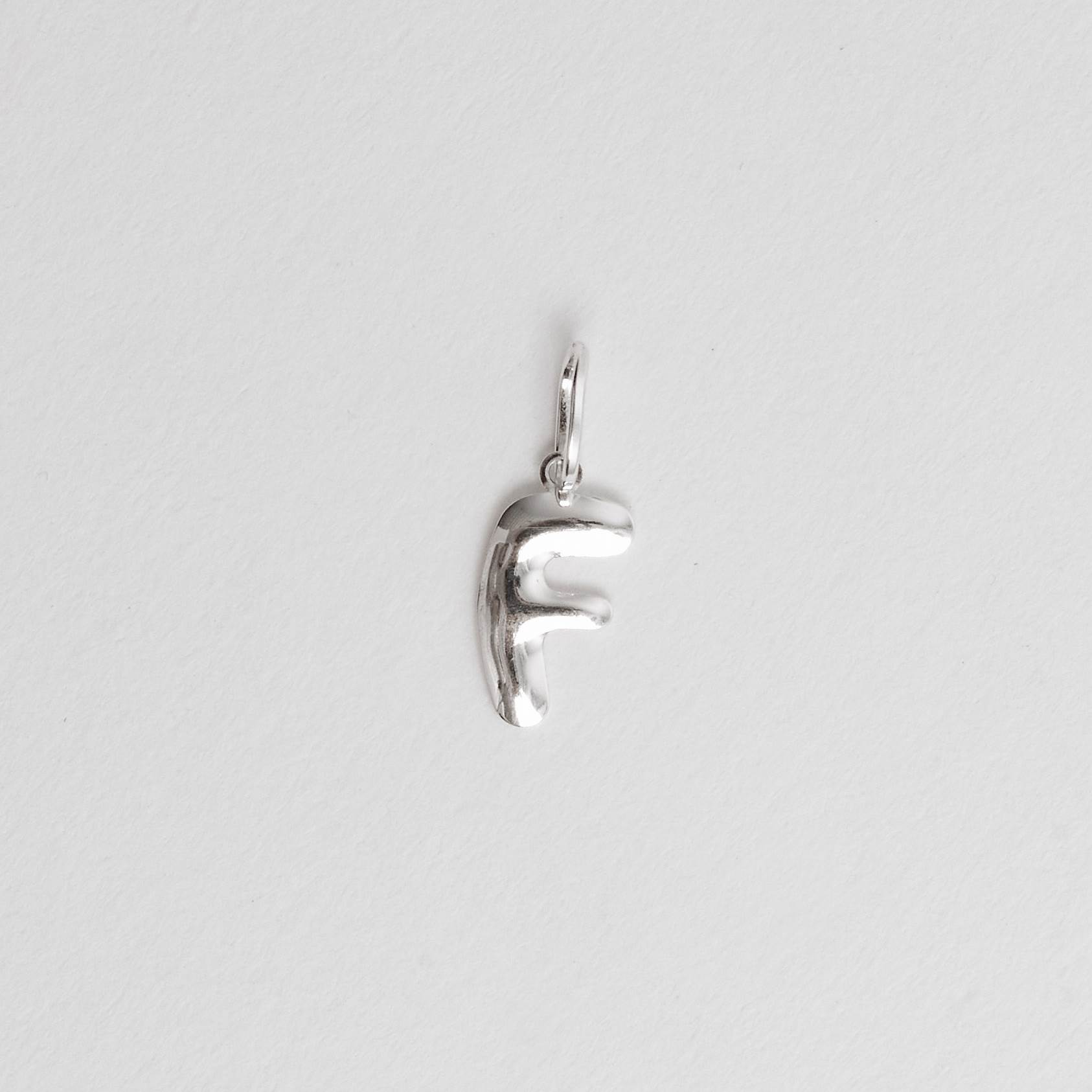 Imagem Secundária Pingente letra F 15mm