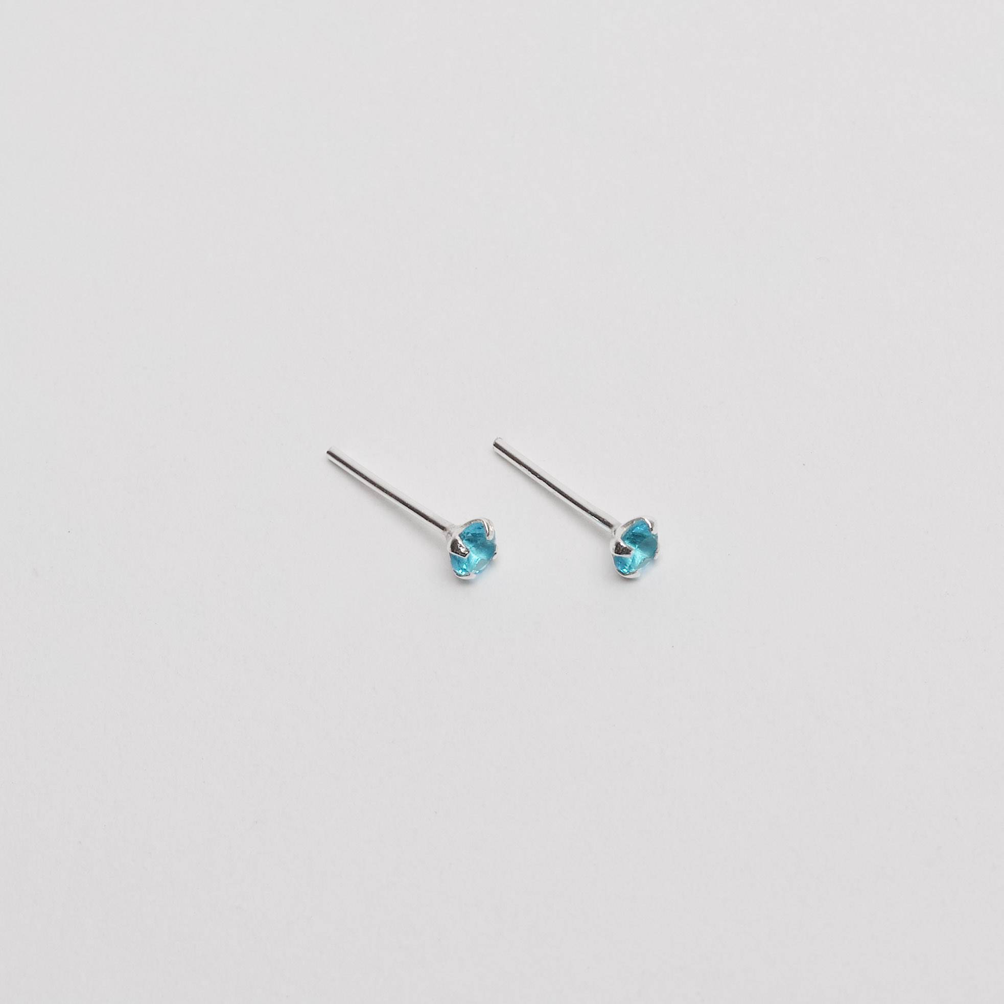 Imagem Secundária Brinco zircônia redonda azul 3mm garra